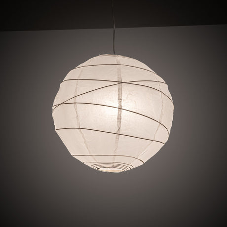Illuminated paper lantern pendant in a dark room.