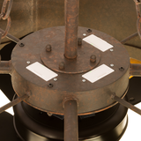Close-up of central motor housing with rustic finish and structural bolts.