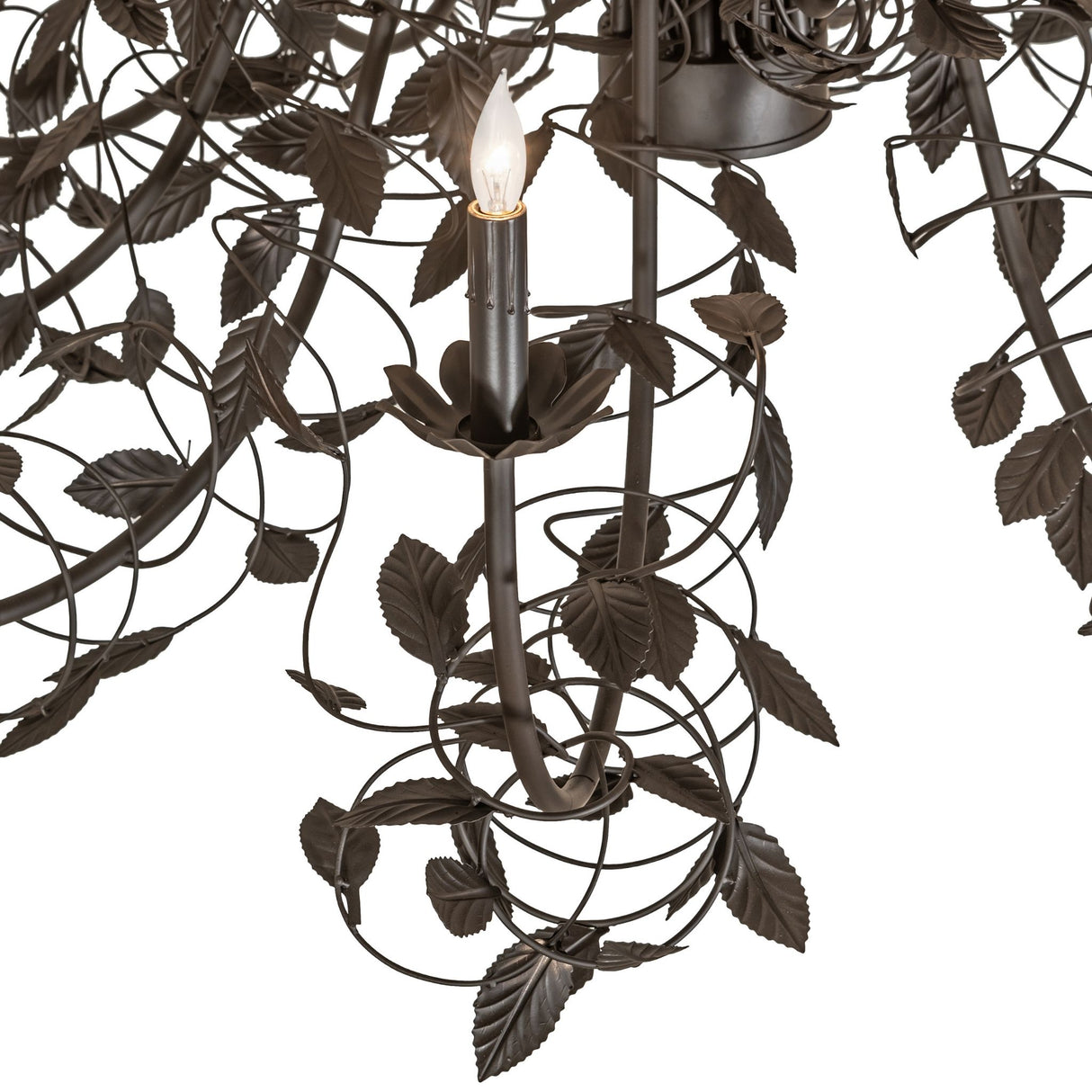 Closeup of Pear Leaf chandelier arm with leaf detailing and candle bobeche.