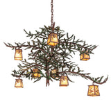 Pine branch chandelier fully lit, featuring glowing iridescent glass lanterns on rustic branch arms.
