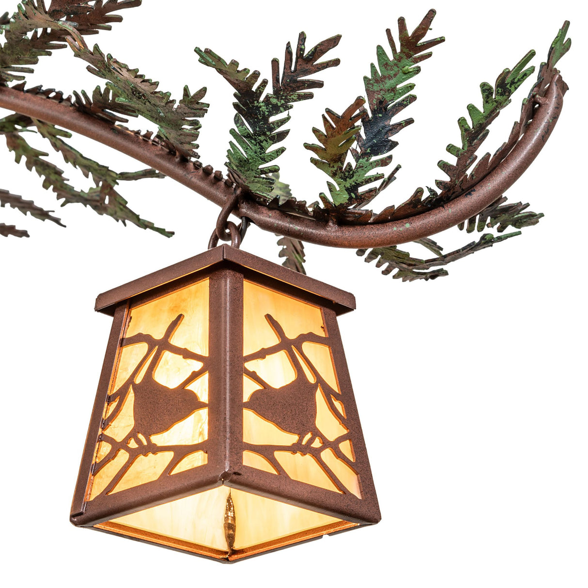Lit bottom view of pine branch chandelier lantern shade with beige iridescent glass.