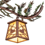 Lit bottom view of pine branch chandelier lantern shade with beige iridescent glass.