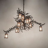 Pine branch chandelier casting warm ambient light in an interior setting.