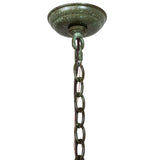 Close-up of the chandelier canopy and hanging chain with rustic green finish.
