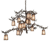 Pine Branch 12 light chandelier lit with silver mica lanterns and pine branch metal arms.