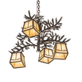 Angle view of 4 Light Chandelier showing bronze pine branches and glowing lanterns.
