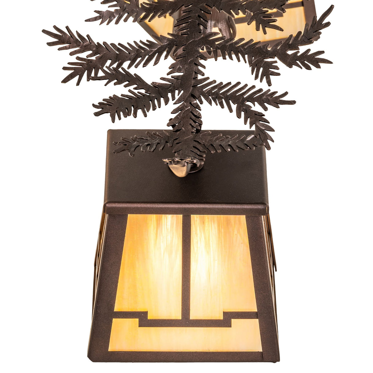 Close view of stained glass lantern shade and pine branch metalwork details.