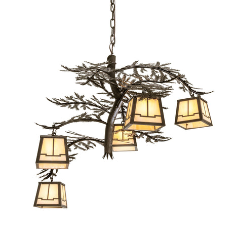 Lit view chandelier with five art glass lanterns and pine needle metal accents.