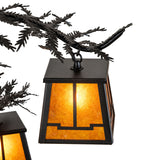 Detailed view metal arms with layered pine needle accents in textured black finish.