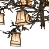 Detailed view of pine branch metal arms and needle accents on Valley View chandelier.