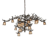 Pine branch 18-light chandelier lit view showing pine branch design and glowing lanterns.