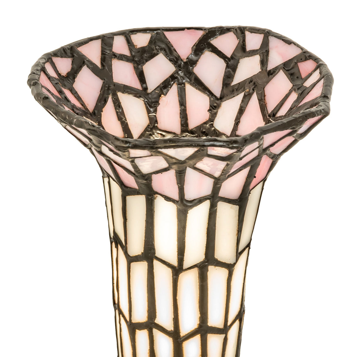 Close-up of pink and white stained glass shade with intricate patterns.
