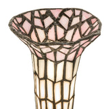 Close-up of pink and white stained glass shade with intricate patterns.