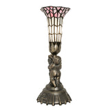 Side view of pink and white stained glass cherub lamp.