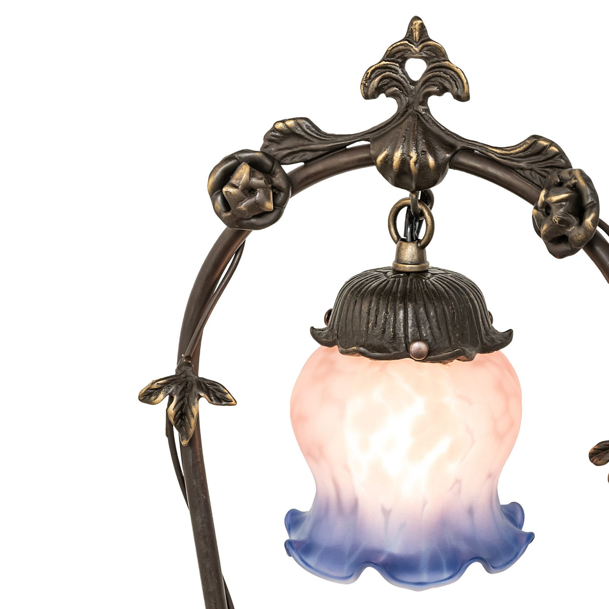 Close-up of the pink and blue ruffled glass shade of the lamp.