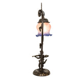Side view of Cherub With Violin Mini Lamp featuring bronze trellis base.