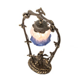 Top angle highlighting the intricate trellis and glass shade of the cherub lamp.