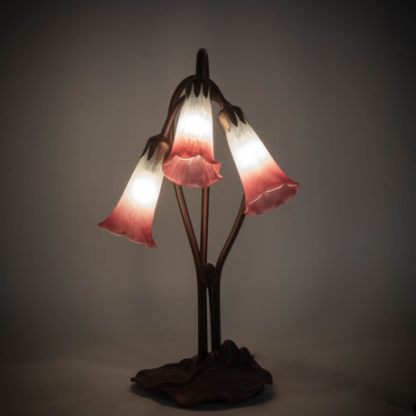 illuminated amber view of pink/white pond lily accent lamp with glowing plum pink and white shades.