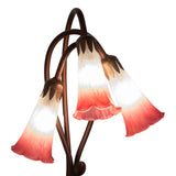 closeup view of plum pink and white hand-blown glass shades on pond lily accent lamp.