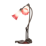 Angled view of the Pink/White Tiffany Pond Lily accent lamp featuring artistic stems and shades.