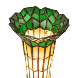 Close-up of the stained glass shade in green and beige on the Pond Lily Twin Cherub Accent Lamp.