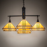 Ambient lighting of chandelier showing warm maize gold art glass and mission-style design.