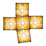 Bottom view of chandelier showing square stained glass shade undersides.