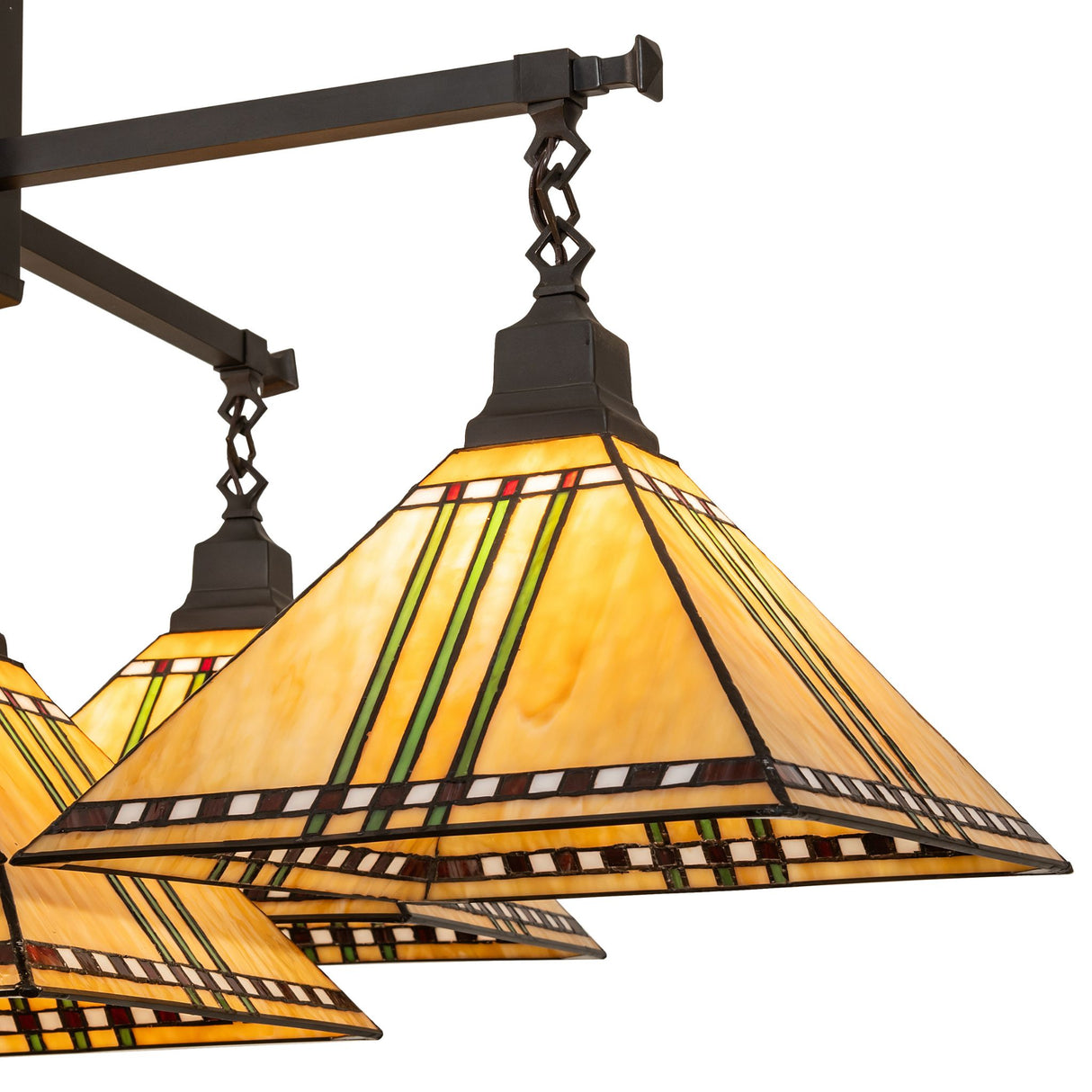 Close-up of chandelier shade showing maize gold stained glass and suspension arm.