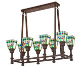 Lit view of 8-light oblong chandelier with stained glass shades and cafe noir finish.