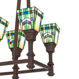 Close-up of Prairie Wheat stained glass shade with green, cream, blue, and red accents.