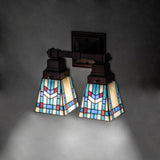 Lighting effect of Prairie Wheat Wall Sconce creating a warm ambiance on a wall.