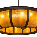 Close-up of amber mica diffuser with visible bronze bracket detailing.