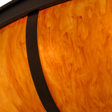 Detailed closeup of amber Idalight diffuser texture and bronze trim.