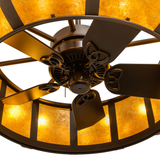 Detailed view of fan blades beneath glowing amber mica dome.
