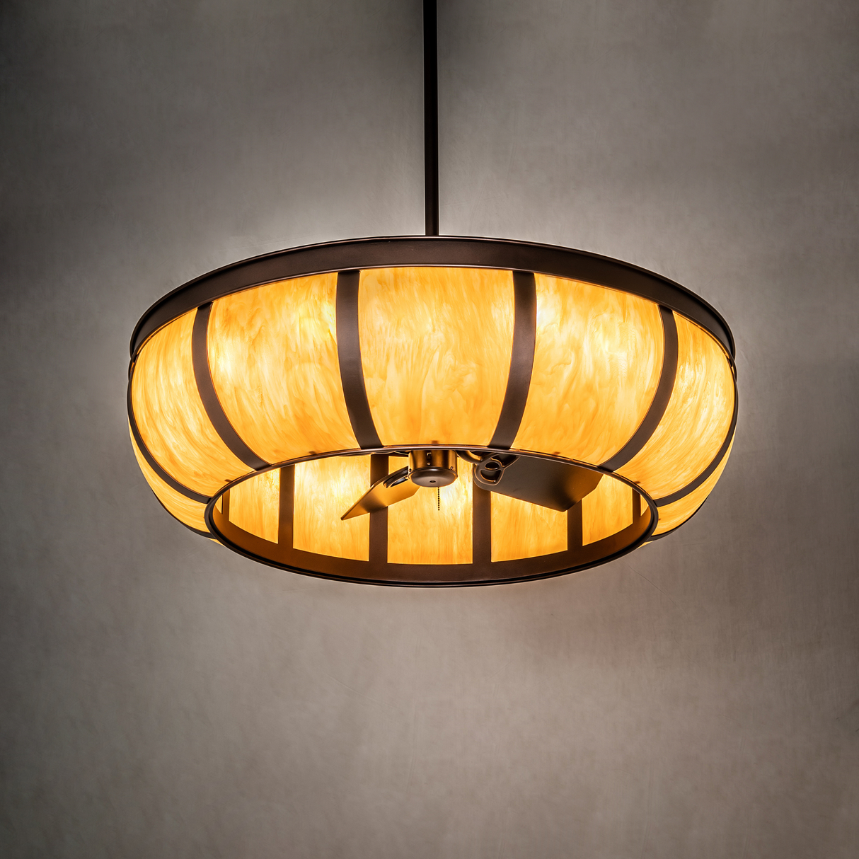 Prime Dome chandelier fan illuminating wall with warm Craftsman style glow.