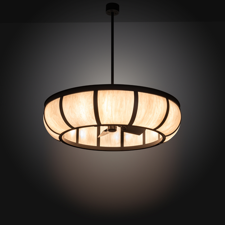 Illuminated Prime Dome Chandel-Air glowing warmly in dark room setting.