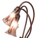 Close-up of the intricate stained glass and bronze details on the Tiffany Pond Lily accent lamp.