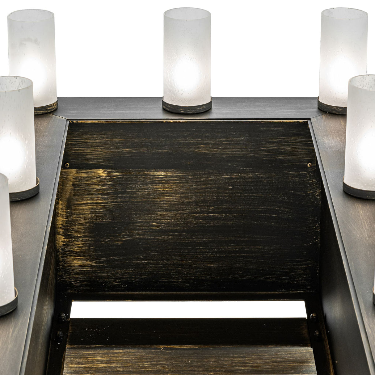 Close-up of the top platform with frosted glass uplight cylinders illuminated.
