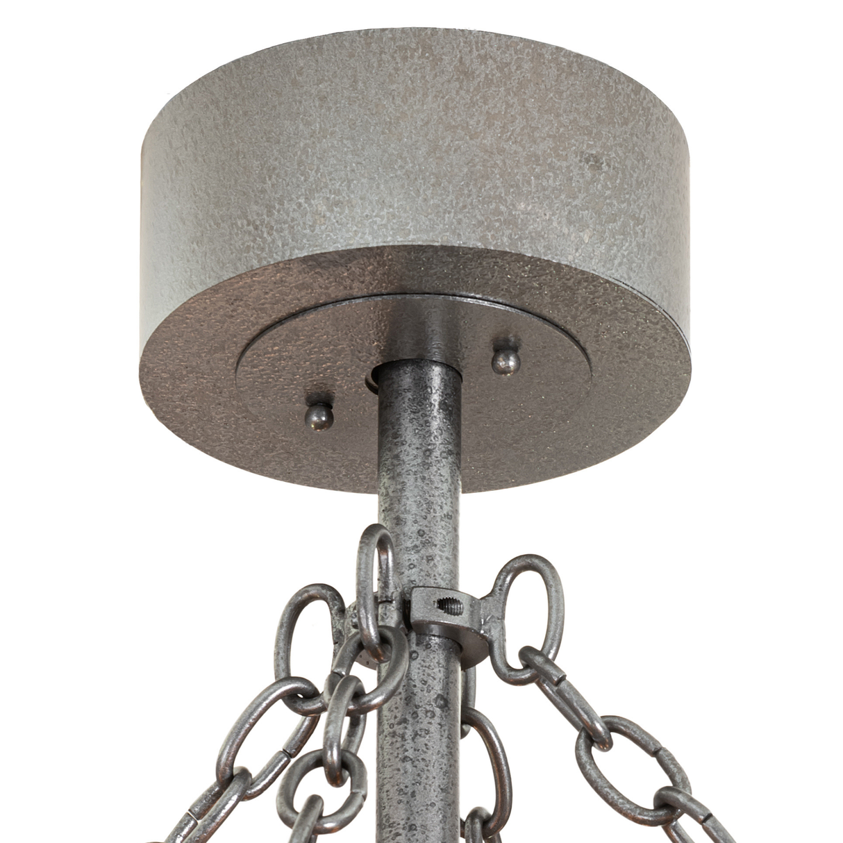 Close-up of canopy and chain connection in textured iron finish.