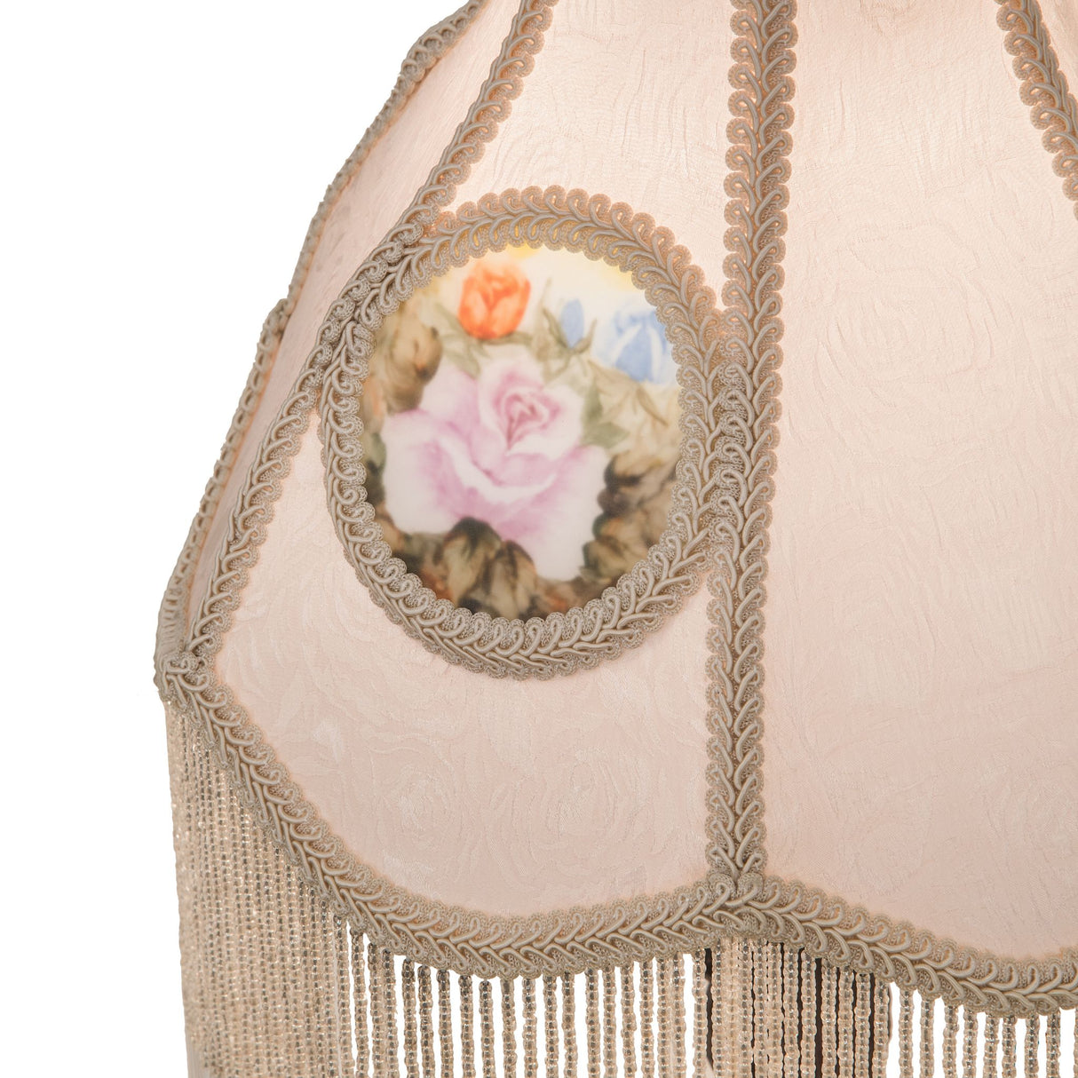 Close-up of the hand-painted floral medallion on the reverse-painted roses table lamp.