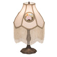 Full view of a 20" high reverse-painted roses table lamp with ivory fabric and fringe.