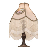 Sculpted metal base of the reverse-painted roses table lamp in a mahogany bronze finish.