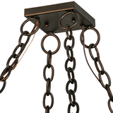 Close-up of ceiling chain and mounting plate of chandelier.