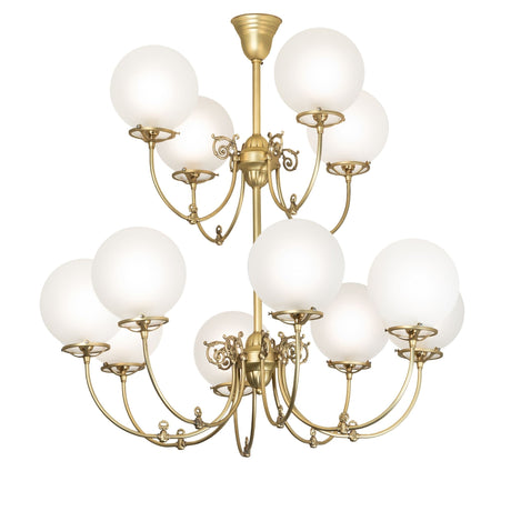 Lit view of polished brass 12-light chandelier with frosted globe shades.
