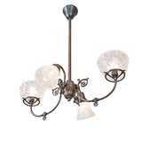 Bottom angle view of revival gas and electric chandelier revealing etched glass patterns and structure.