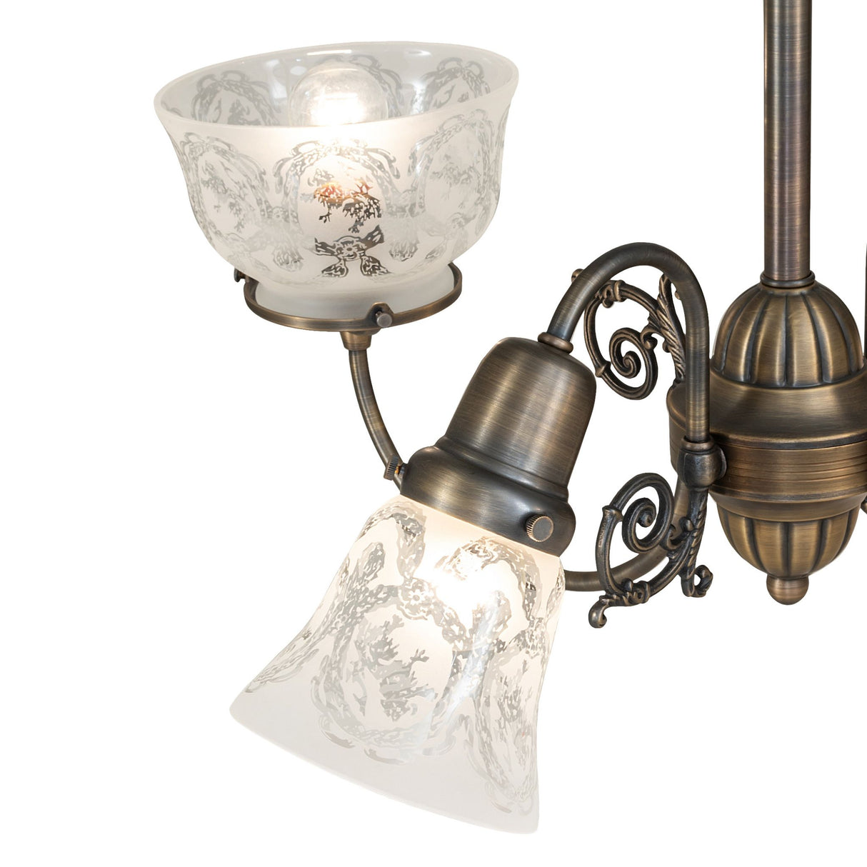Detailed view of clear etched glass shade with wreath and garland motif.