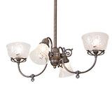 Revival gas and electric chandelier lit with etched glass shades and antique brass finish.