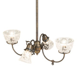 Top view of Revival chandelier displaying etched glass interiors and central brass hub.