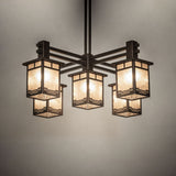 Roylance chandelier casting soft ambient light in a warm interior setting.