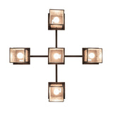 Bottom view of chandelier showing open lantern bases and bulb placement.